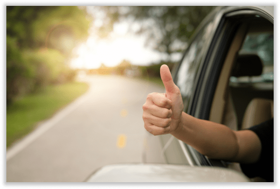 Thumbs up from car window